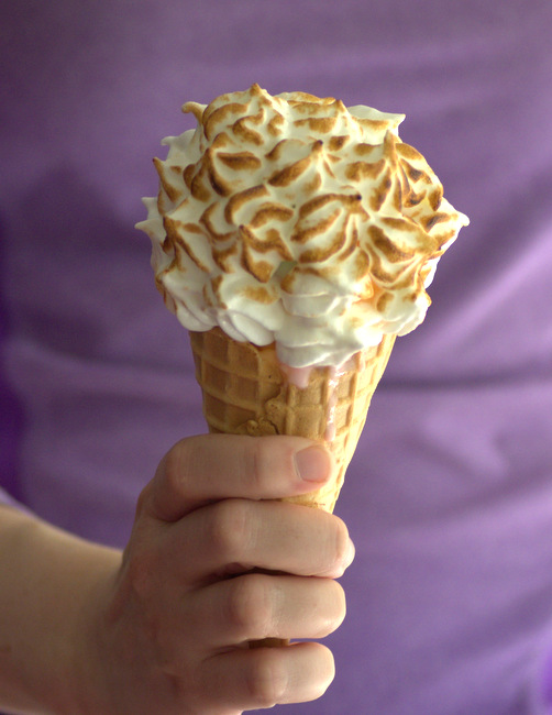 MAN HOLDING DELICIOUS CLOUD SHAPED ICE CREAM